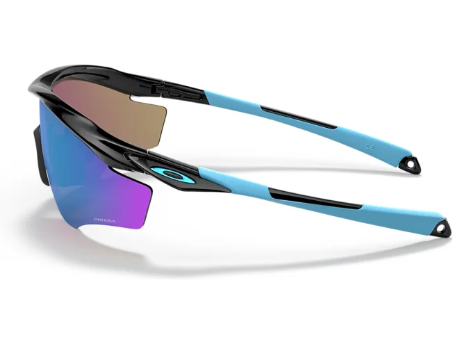 Oakley M2 Frame XL p&auml;ikeseprillid k&uuml;ljelt, n&auml;ha lillakas Prizm-l&auml;&auml;tse v&auml;rving ja helesinised sangad